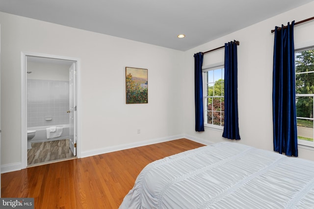 7 Shady Brook Ln, Cranbury, NJ 08512 - bedroom with wood finished floors, recessed lighting, and ensuite bathroom