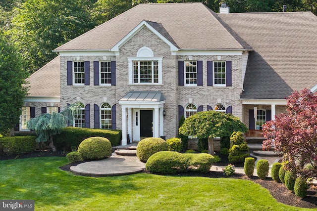 7 Shady Brook Ln, Cranbury, NJ 08512 - georgian-style home with brick siding, a front yard, a chimney, and roof with shingles