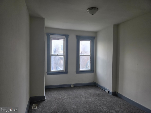 1806 N Bentalou St, Baltimore, MD 21216 - spare room featuring dark carpet and baseboards