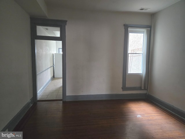 1806 N Bentalou St, Baltimore, MD 21216 - spare room with wood finished floors and baseboards