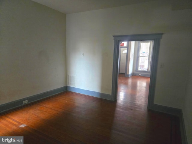1806 N Bentalou St, Baltimore, MD 21216 - empty room with wood finished floors and baseboards