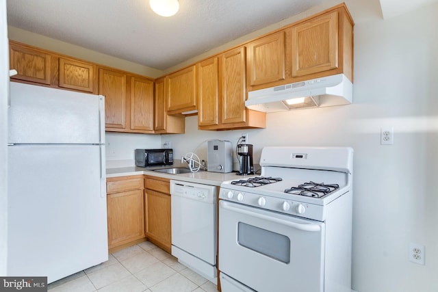 2500 N Van Dorn St Unit 415, Alexandria, VA 22302 - kitchen featuring white appliances, under cabinet range hood, light countertops, and light tile patterned floors