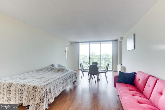 2500 N Van Dorn St Unit 415, Alexandria, VA 22302 - bedroom featuring expansive windows, access to outside, and wood finished floors