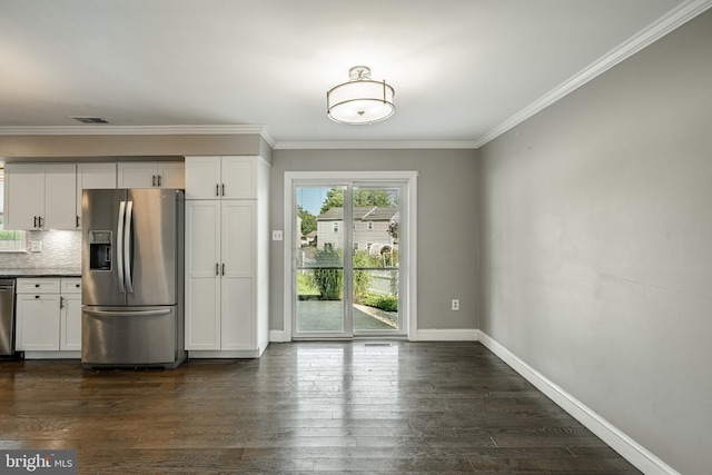 2107 Carol Ln, East Norriton, PA 19401 - kitchen featuring stainless steel appliances, crown molding, white cabinetry, dark wood-style floors, and tasteful backsplash