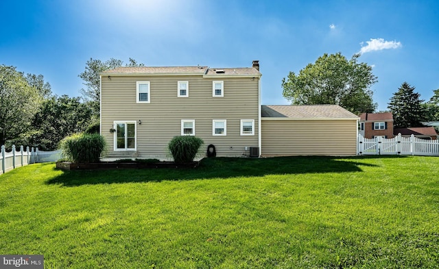 2107 Carol Ln, East Norriton, PA 19401 - rear view of property featuring a fenced backyard, a chimney, and a gate