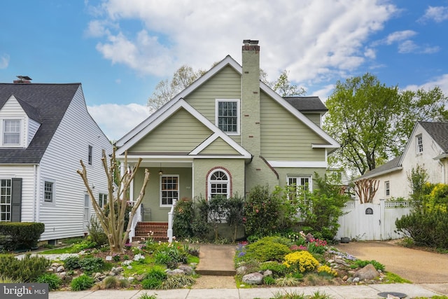 304 Summers Dr, Alexandria, VA 22301 - traditional-style house with a porch, a gate, and a chimney