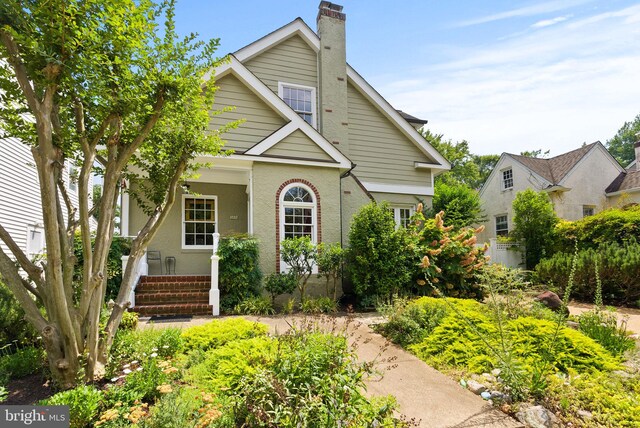 304 Summers Dr, Alexandria, VA 22301 - traditional home with a chimney and covered porch