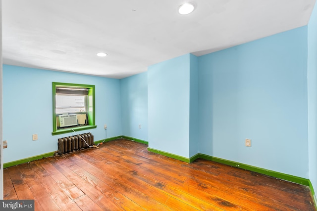 1148 S 12th St, Philadelphia, PA 19147 - unfurnished room featuring cooling unit, radiator heating unit, hardwood / wood-style floors, and recessed lighting