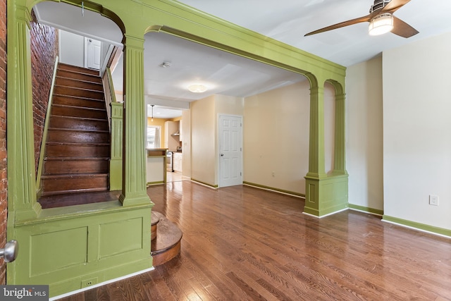 1148 S 12th St, Philadelphia, PA 19147 - foyer entrance featuring decorative columns, a ceiling fan, wood finished floors, and stairs
