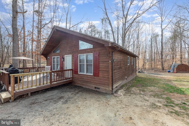 1702 Willow Brook Rd, Bumpass, VA 23024 - view of home's exterior with crawl space, a wooden deck, and a shed
