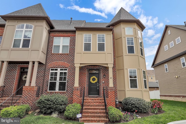 1144 Holden Rd, Frederick, MD 21701 - view of front of house with roof with shingles, brick siding, and stucco siding
