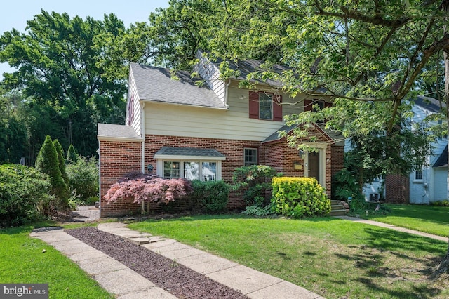 416 Copley Rd, Haddonfield, NJ 08033 - traditional-style house featuring a front yard, brick siding, and a shingled roof