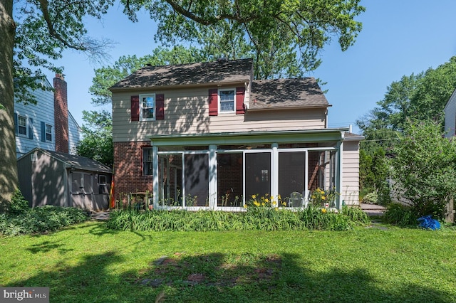 416 Copley Rd, Haddonfield, NJ 08033 - rear view of property with a sunroom, a storage shed, a lawn, and brick siding