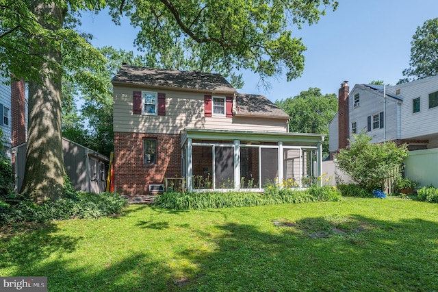 416 Copley Rd, Haddonfield, NJ 08033 - rear view of property featuring brick siding and a sunroom