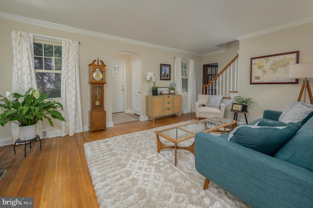 416 Copley Rd, Haddonfield, NJ 08033 - living area featuring arched walkways, ornamental molding, stairs, and hardwood / wood-style floors