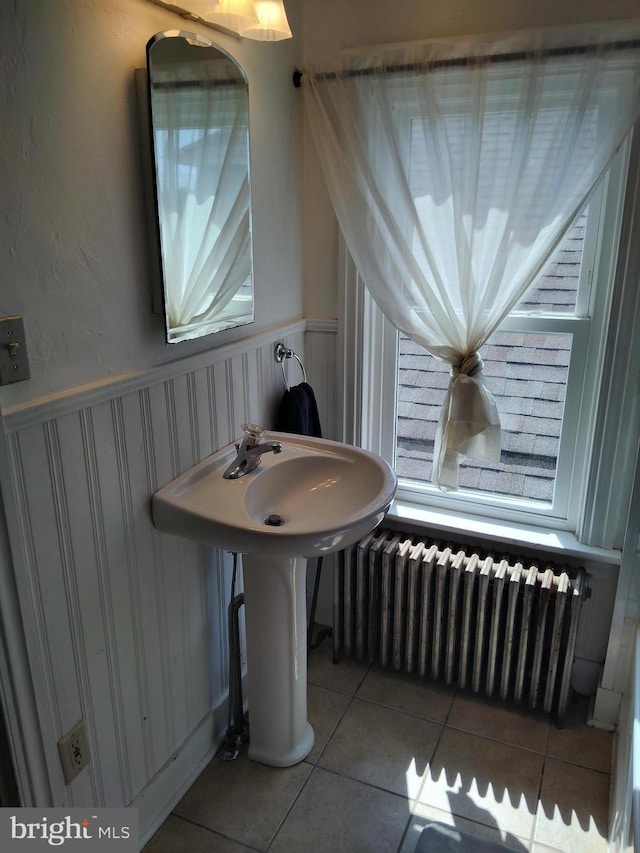 221 Princess St, Hanover, PA 17331 - bathroom featuring radiator heating unit, tile patterned floors, and wainscoting