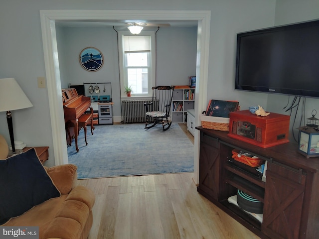 221 Princess St, Hanover, PA 17331 - living area featuring radiator and wood finished floors