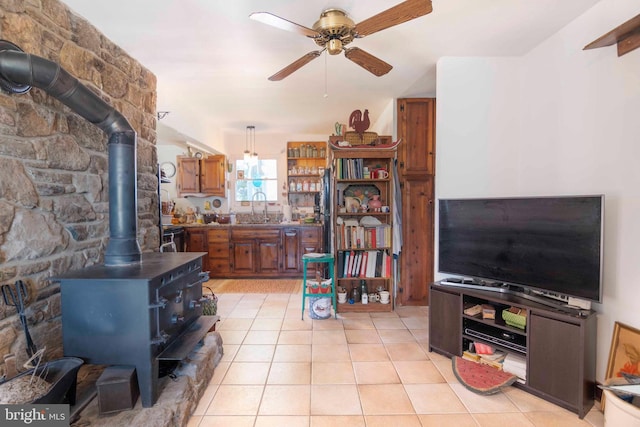 1119 Summit Ave, Front Royal, VA 22630 - living room with a wood stove, a ceiling fan, and light tile patterned flooring