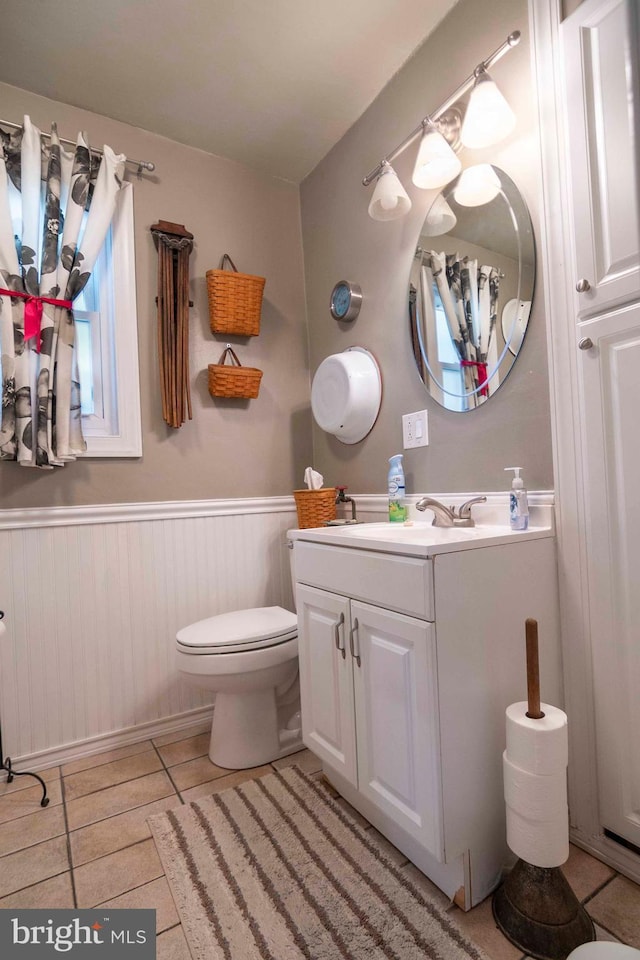 1119 Summit Ave, Front Royal, VA 22630 - bathroom with vanity, wainscoting, and tile patterned flooring