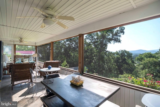 1119 Summit Ave, Front Royal, VA 22630 - sunroom with a ceiling fan, outdoor dining space, a mountain view, and outdoor lounge area