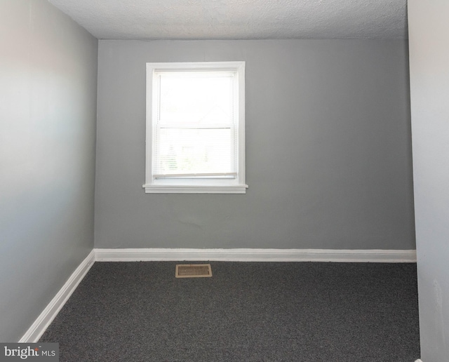 4917 Pembridge Ave, Baltimore, MD 21215 - carpeted spare room featuring baseboards and a textured ceiling