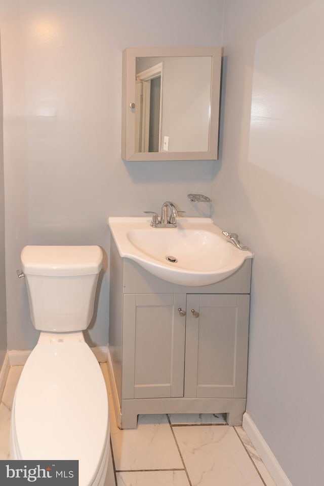 4917 Pembridge Ave, Baltimore, MD 21215 - half bathroom with vanity and marble finish floors