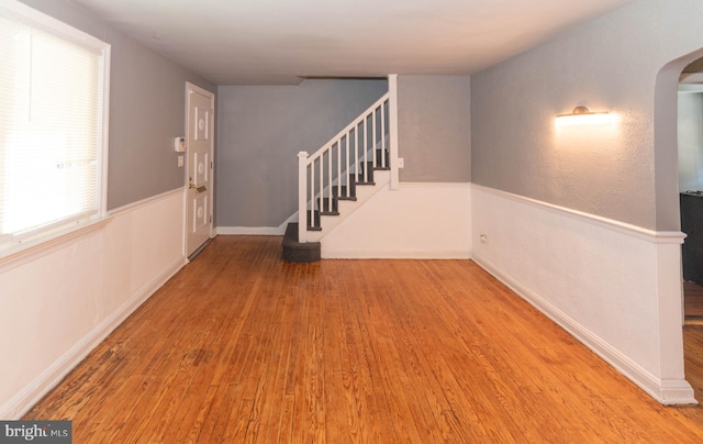 4917 Pembridge Ave, Baltimore, MD 21215 - foyer entrance with stairway, arched walkways, and wood finished floors