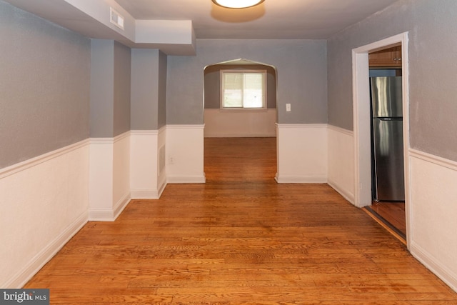 4917 Pembridge Ave, Baltimore, MD 21215 - hall with arched walkways and light wood-style floors