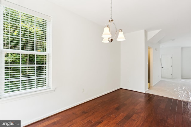12814 Sutherby Ln, Germantown, MD 20874 - empty room featuring hardwood / wood-style floors and a chandelier