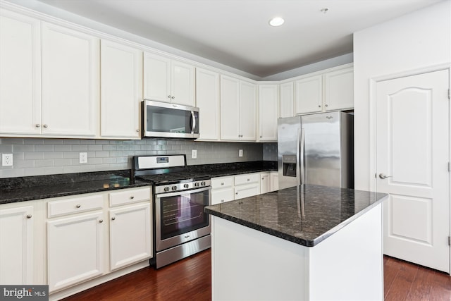 12814 Sutherby Ln, Germantown, MD 20874 - kitchen featuring stainless steel appliances, dark wood-style floors, white cabinets, backsplash, and dark stone countertops