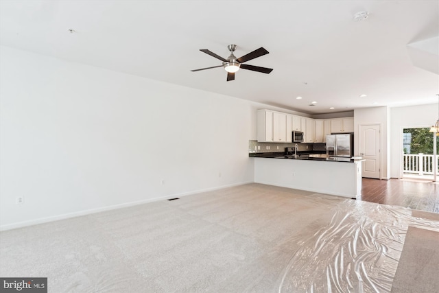 12814 Sutherby Ln, Germantown, MD 20874 - unfurnished living room featuring ceiling fan and recessed lighting
