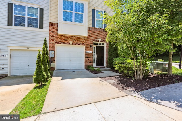 12814 Sutherby Ln, Germantown, MD 20874 - view of front of home with concrete driveway, brick siding, and a garage
