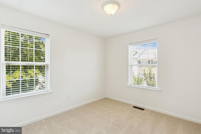 12814 Sutherby Ln, Germantown, MD 20874 - unfurnished room featuring plenty of natural light and carpet flooring
