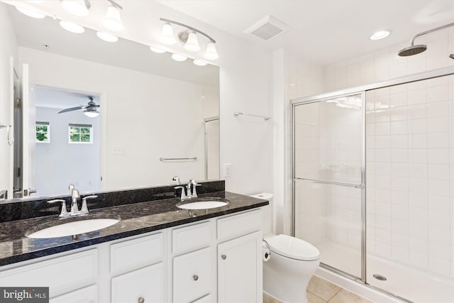 12814 Sutherby Ln, Germantown, MD 20874 - full bathroom featuring a shower stall, double vanity, tile patterned flooring, and a ceiling fan