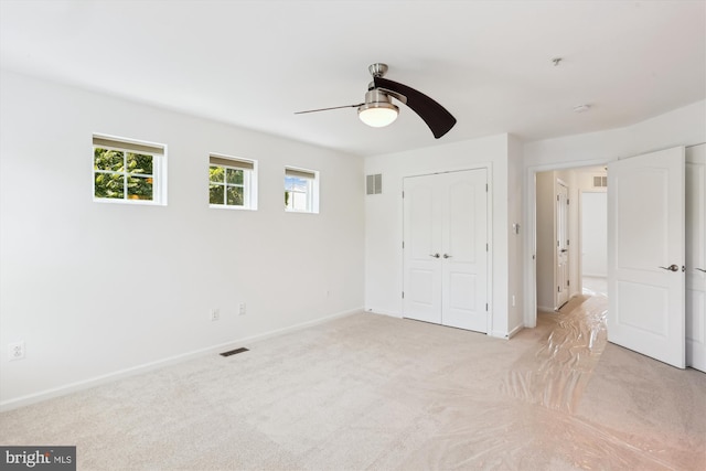 12814 Sutherby Ln, Germantown, MD 20874 - unfurnished bedroom with light carpet, a closet, and a ceiling fan
