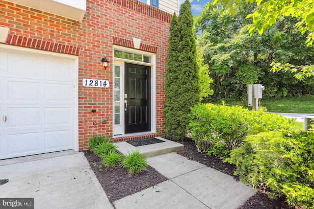 12814 Sutherby Ln, Germantown, MD 20874 - property entrance featuring brick siding and an attached garage