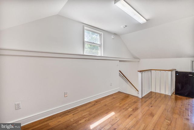 7901 Warfield Rd, Gaithersburg, MD 20882 - additional living space with wood-type flooring and vaulted ceiling