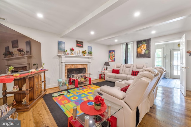 7901 Warfield Rd, Gaithersburg, MD 20882 - living area with a fireplace, light wood-style floors, beam ceiling, and recessed lighting
