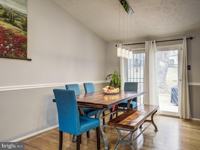 9907 Treetop Ln, Lanham, MD 20706 - dining space featuring a textured ceiling and wood finished floors