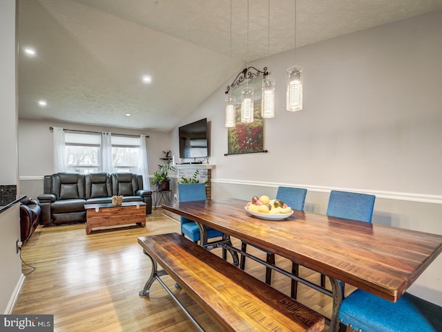 9907 Treetop Ln, Lanham, MD 20706 - dining area featuring light wood-type flooring, recessed lighting, and lofted ceiling