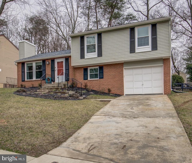 9907 Treetop Ln, Lanham, MD 20706 - tri-level home with brick siding, an attached garage, a front yard, and a chimney