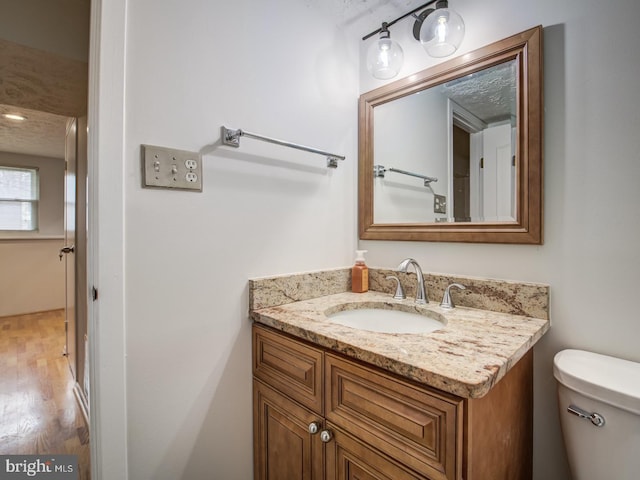 9907 Treetop Ln, Lanham, MD 20706 - bathroom featuring vanity and wood finished floors