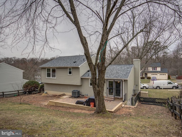 9907 Treetop Ln, Lanham, MD 20706 - back of house with a chimney and a shingled roof