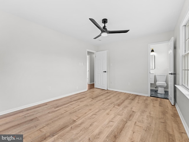 357 Avis Mill Rd, Pilesgrove, NJ 08098 - unfurnished bedroom with light wood-type flooring, ensuite bathroom, a ceiling fan, and multiple windows