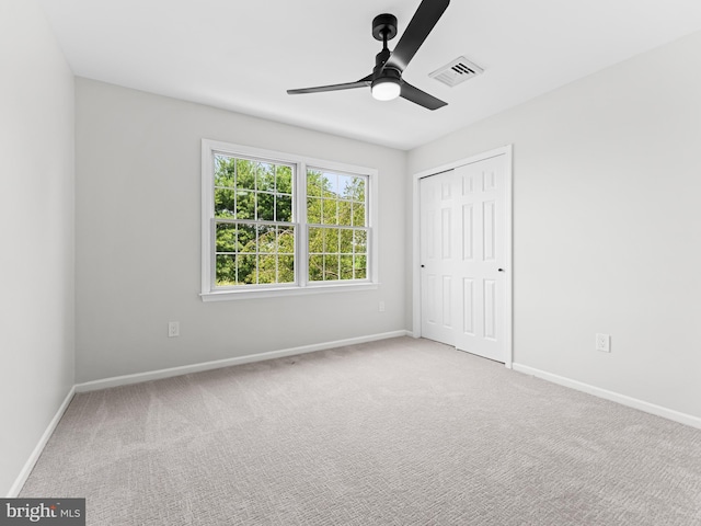 357 Avis Mill Rd, Pilesgrove, NJ 08098 - unfurnished bedroom with carpet floors, a closet, and a ceiling fan