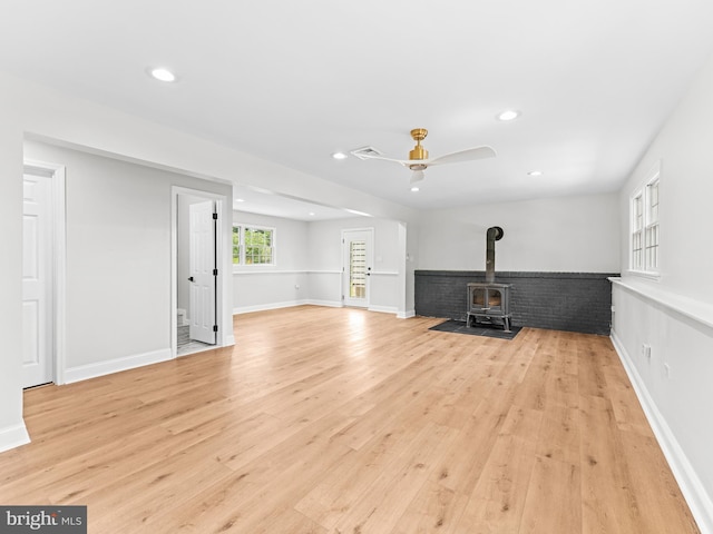 357 Avis Mill Rd, Pilesgrove, NJ 08098 - unfurnished living room with a wood stove, light wood-type flooring, recessed lighting, a ceiling fan, and stairs