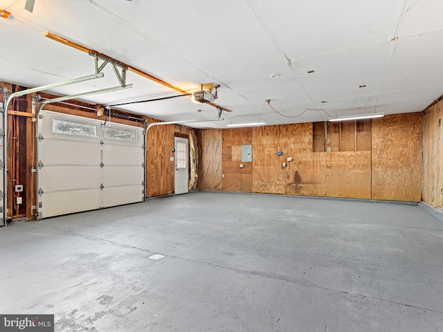 357 Avis Mill Rd, Pilesgrove, NJ 08098 - garage featuring wood walls and a garage door opener