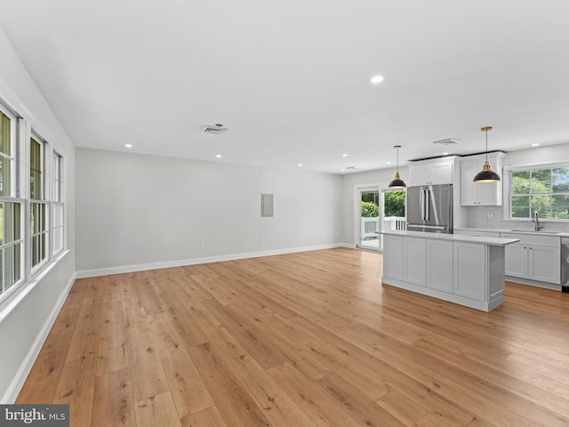357 Avis Mill Rd, Pilesgrove, NJ 08098 - unfurnished living room with recessed lighting and light wood finished floors