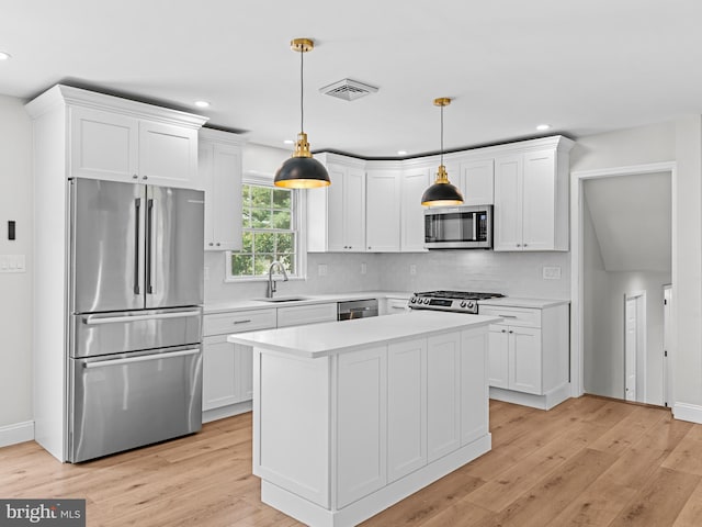 357 Avis Mill Rd, Pilesgrove, NJ 08098 - kitchen featuring appliances with stainless steel finishes, light countertops, white cabinets, recessed lighting, and backsplash