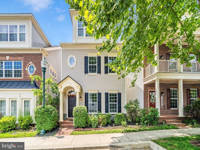 12404 Carriage Park Pl, Clarksburg, MD 20871 - townhome / multi-family property with brick siding and a balcony